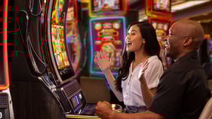 Couple playing slots at Grand Sierra Resort.